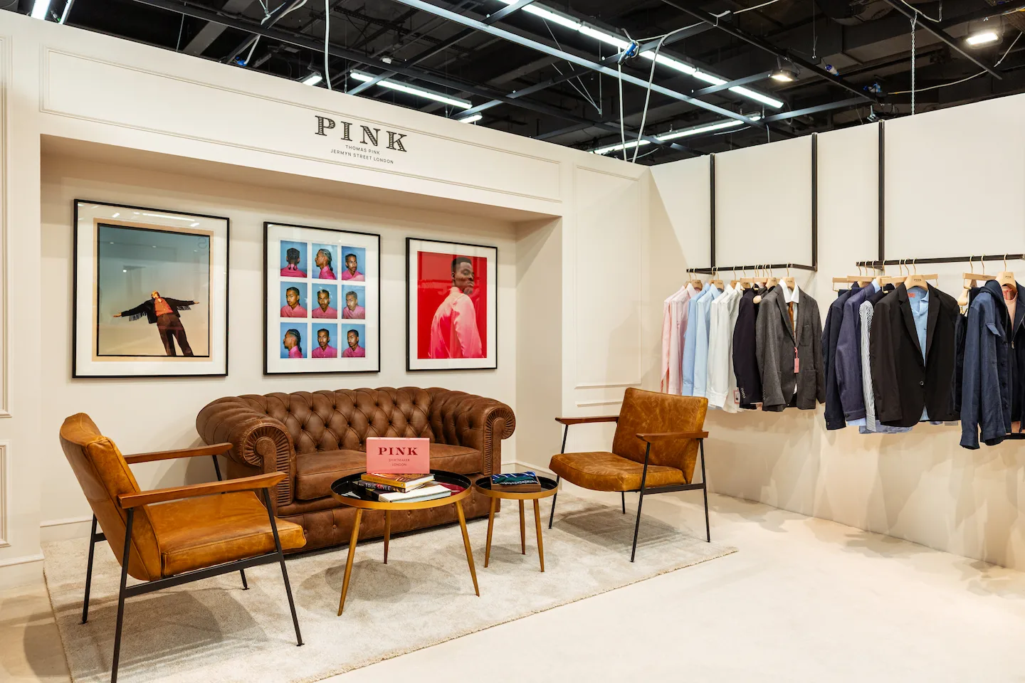 Thomas Pink showroom with a leather sofa and clothing rail