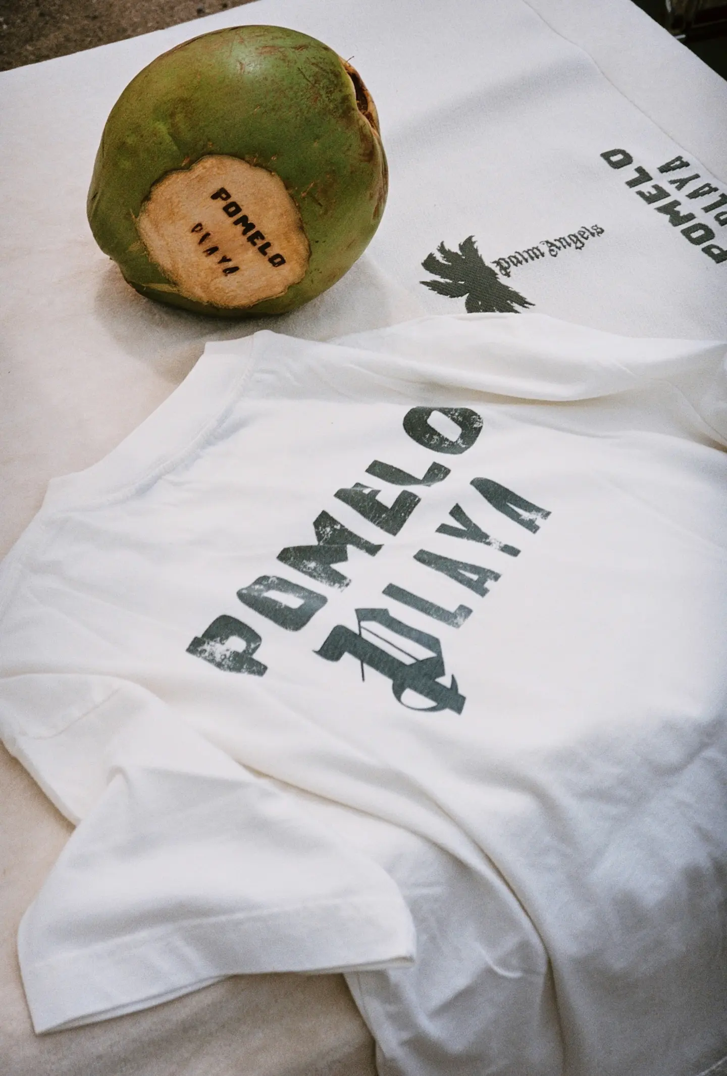 Coconut on white Pomelo Playa Palm Angels t-shirts